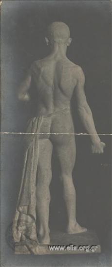 Statue of a young man, rear view  - by Kostas Dimitriadis