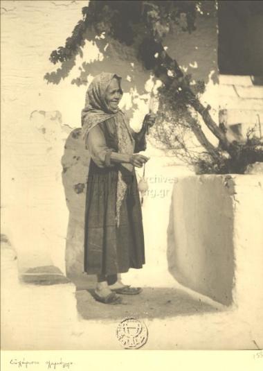 An old woman spinning wool