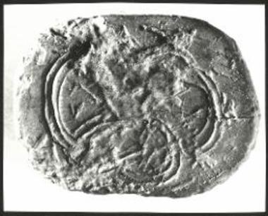 Η σφραγιστική επιφάνεια τριπλεύρου ελεφαντίνης σφραγίδος.