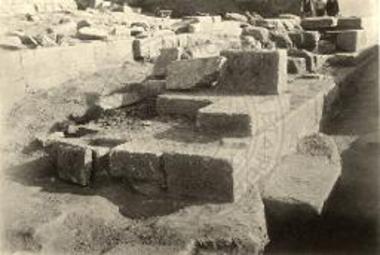 Tower and painted grave stelai in situ.