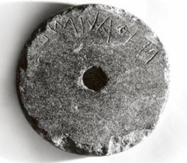 Inscribed fishing weight.