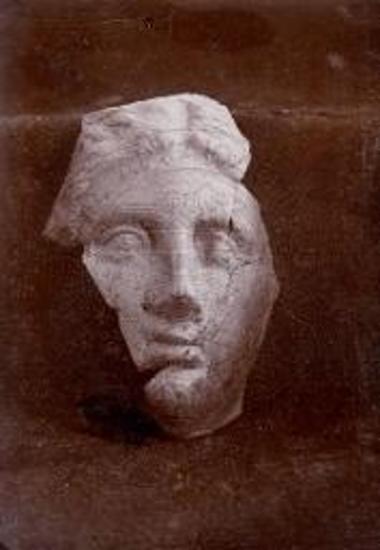 Head of clay female figurine.