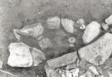 Inscribed fishing weight.