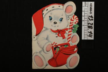 Ευχητήρια κάρτα - χριστουγεννιάτικη κάρτα, σε σχήμα μικρής λευκής αρκούδας με κόκκινη τσάντα (μονόφυλλη)