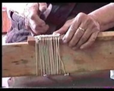 Eirini Mpampa showing the preparation of the loom