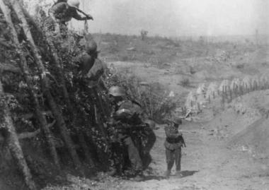 April 1941. German soldiers climbing with the help of improvised scaffolding over anti-tank obstacles of the Metaxa Line trying to open a passage for the rest of the troops