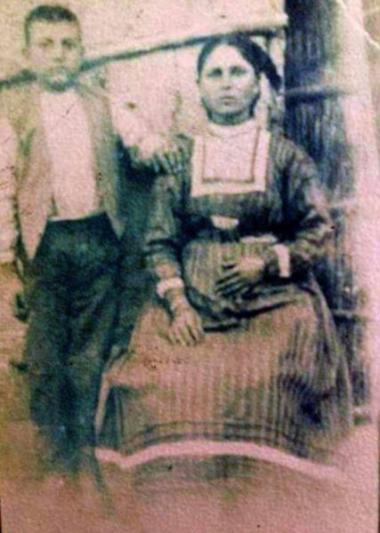Charitomeni Polyzoi-Zaganidou in a dress from Eastern Thrace, with her son, Kalochori, 20th century