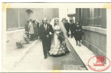 Maria Triantafyllidou on her wedding day. Maria Triantafyllidou's father accompanies his daughter, the bride, to the church