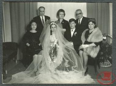 Maria Triantafyllidou with her husband on the day of the religious wedding, in the wedding photo with relatives