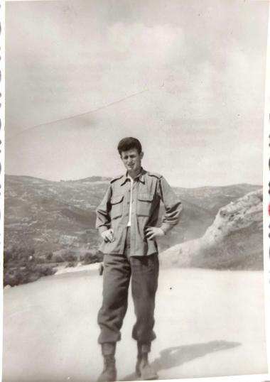 At Tempi, infantry soldiers are laying gravel for the road network in 1958