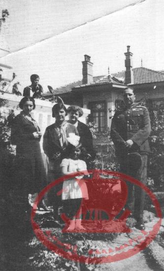 Aretsou. Mrs. Syrou, Cavalry Captain Kassandros with his wife and daughter in the courtyard of the Kondekakis mansion