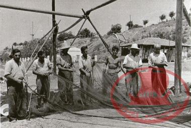 Aretsou Beach, 1952. Fishermen repairing their nets