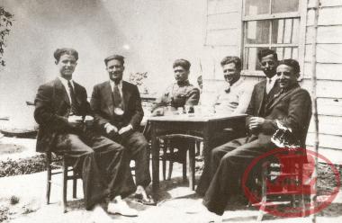 A group of people at a café in Kouri, in the early 1930s