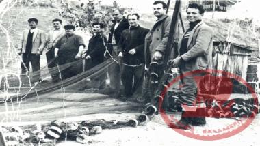 Aretsou. The fishermen have spread out the cotton net and are searching for holes to mend