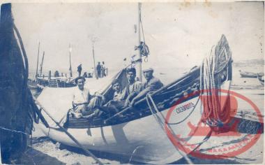Varna. Four fishermen are sitting on a boat