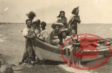 On the beach of Varna, men from Aretsou with their wives enjoy a boat ride