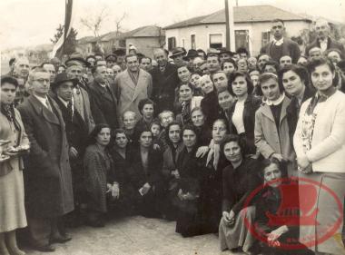 The Karambournaki people gathered on a road in Karambournaki, when the Settlement gave them their houses