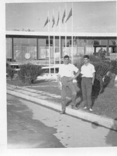 Nikitas Karavasileiadis is photographed in front of a DEI kiosk in Thessaloniki
