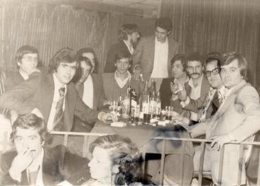 Nikitas Karavasileiadis with a group of friends at an entertainment venue