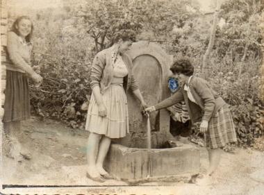Young women at a village fountain in Askos, Volvi