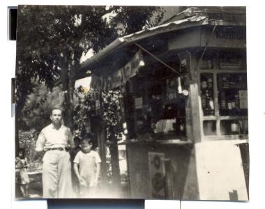 Parris Christodoulou with his 4-year-old son Alekos in front of his first stand at the current intersection of Ethn. Antistaseos and Lasani streets