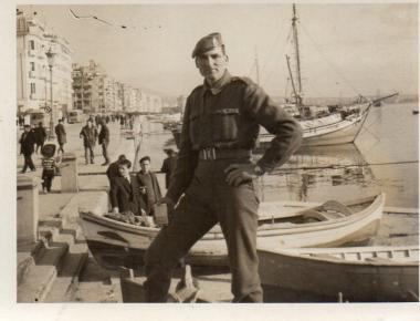 Nikitas Karavasileiadis is photographed in military attire on the beach of Thessaloniki