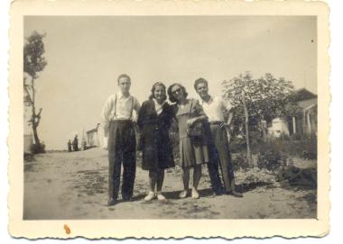 Aristideou Street (unimproved at that time), in front of the current indoor gym of the General Secretariat of Agriculture. The refugee shacks of the time can be seen