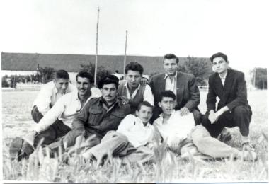 Young people of the Votsi settlement, in front of the allied ward 3A of the military camp.