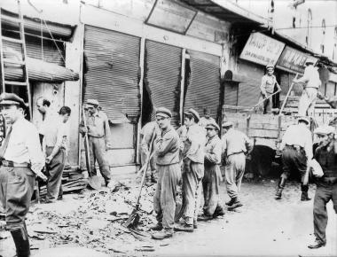 Crews of the Constantinople Municipality, under the supervision of police authorities, clear the debris after the attacks against the Greeks