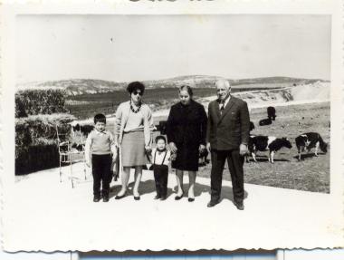Maria Kourbetis-Vogiatzis with her two boys and her parents Chrysanthi and Dimitris, at the family's estate behind the later Carrefour supermarket (now Sklavenitis).