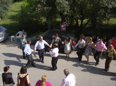 Circular dance with the accompaniment of a clarinet on the eve of the wedding in front of the house of the bride, Sophia Tsirampidou, in Hera Street
