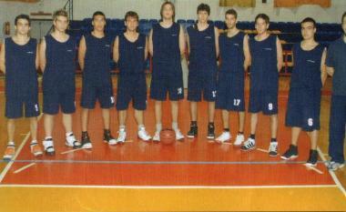 The junior basketball team with coach Akis Kotanidis on the right.