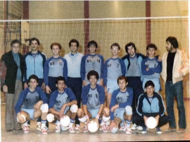 The men's volleyball team with coach G. Zolastathiadis (left) and curator K. Ioakeimidis (right).