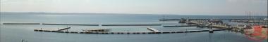 Panoramic view of the port of Aretsou, with the fishing boats and the floating platforms.