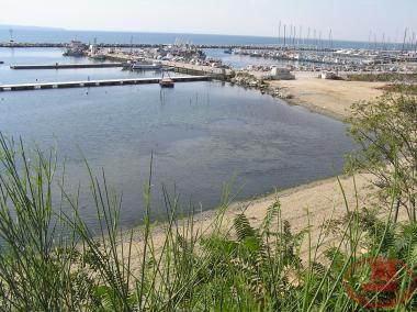 The port of Aretsou with the fishing boats and the floating platforms.