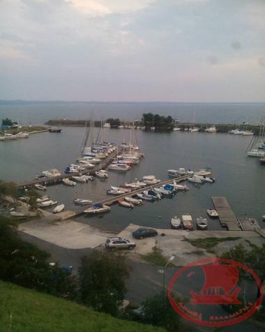 The harbour of the Kalamaria Yacht Club with its floating platforms and boats.