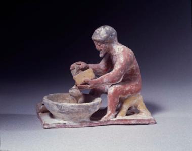 Ειδώλιο άντρα που τρίβει τυρί