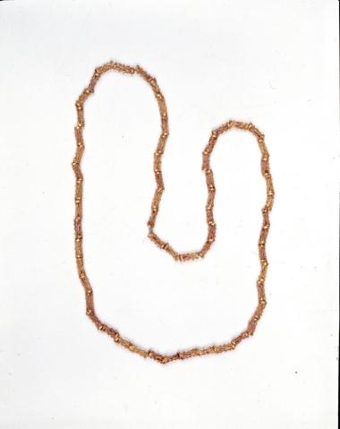 χρυσό περιδέραιο με κυλινδρικές ψήφους