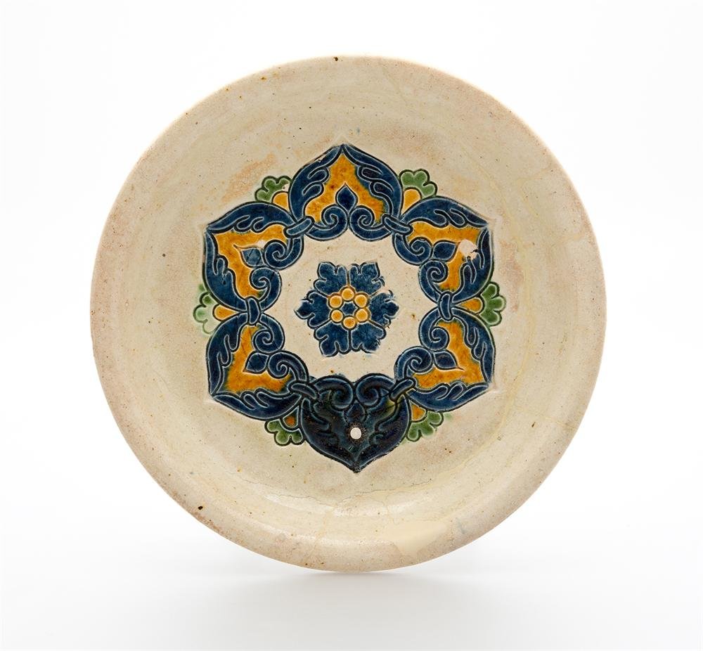 Burial tripod dish of incised, painted and lead glazed earthenware, from Tang dynasty