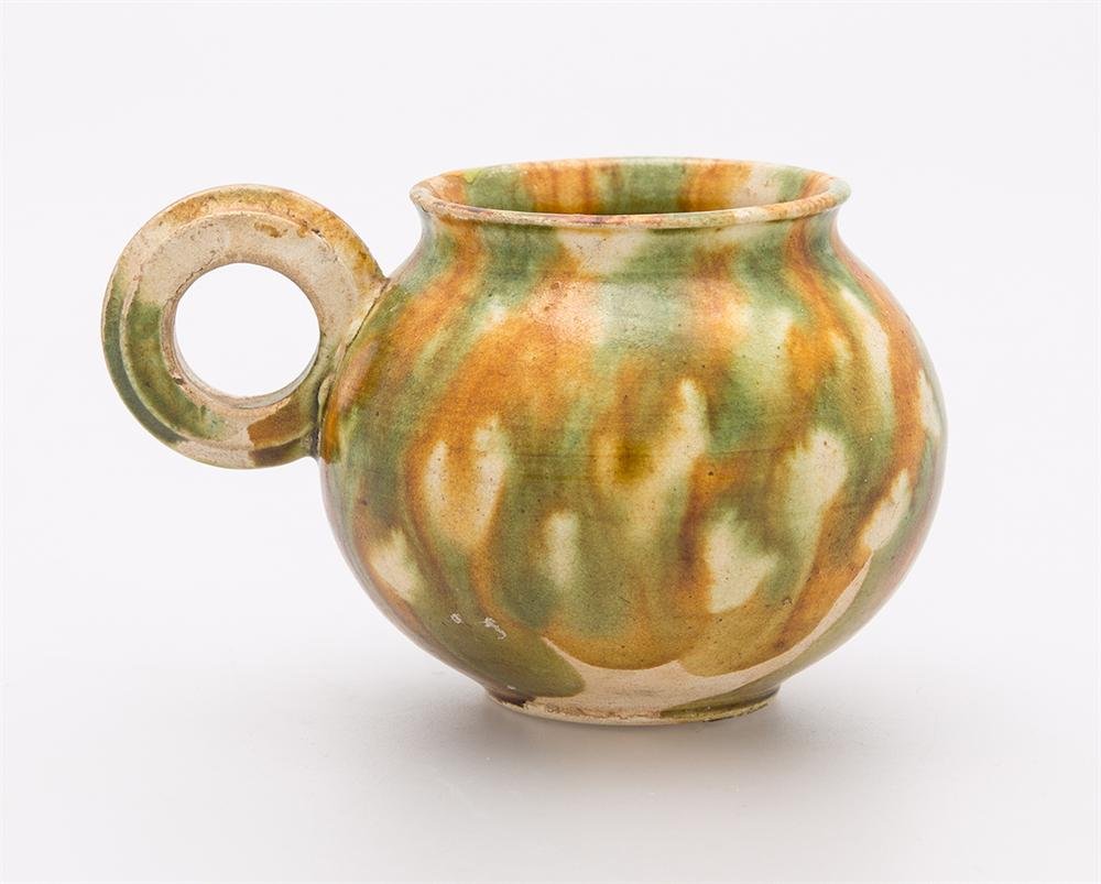 Handled cup of polychrome glazed earthenware