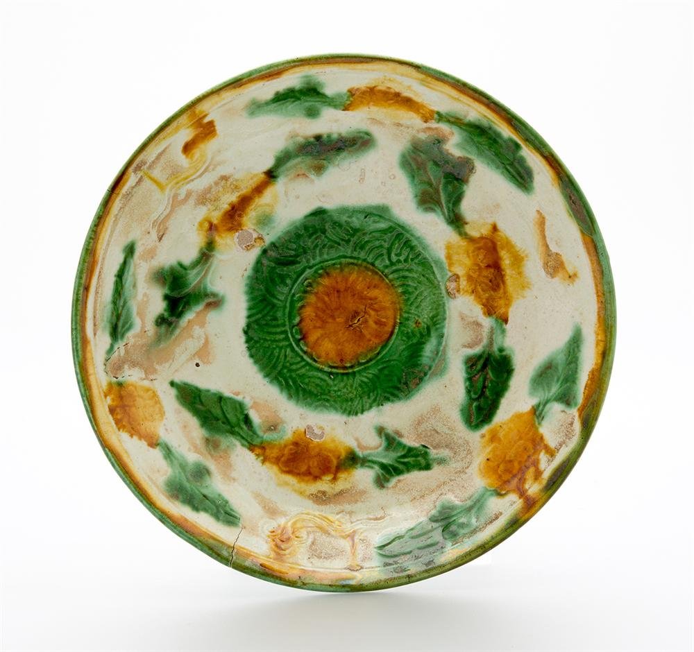 Dish of stoneware with polychrome glaze and impressed decoration