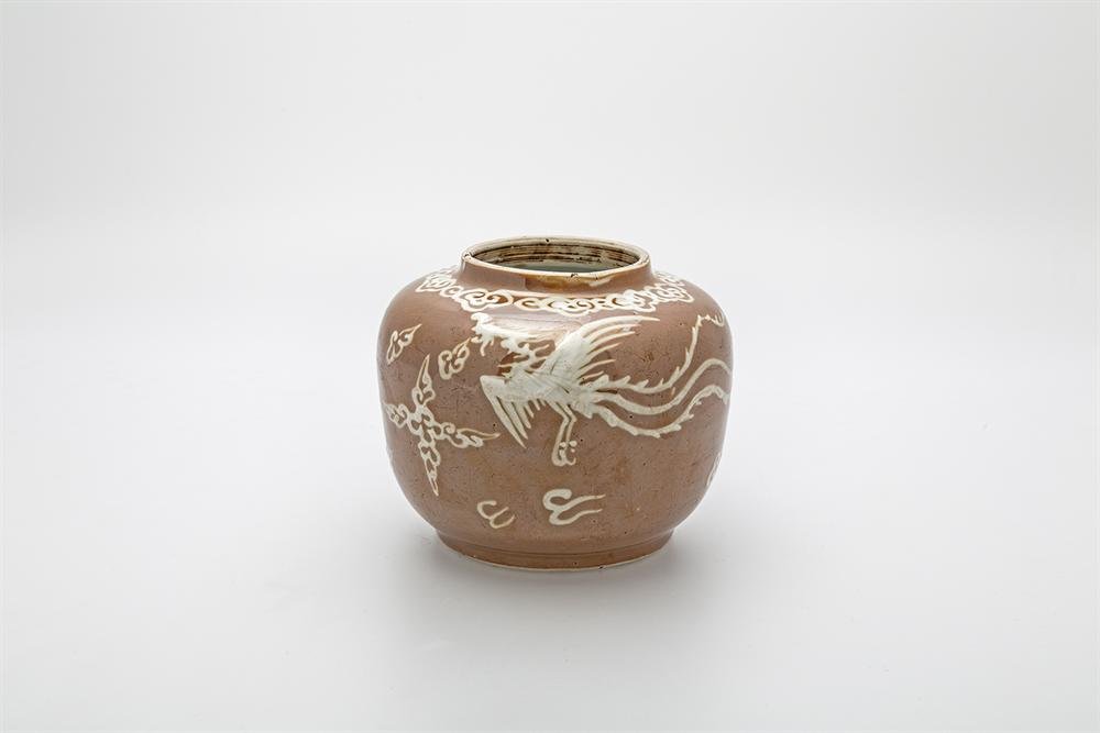 Jar of toffee colour-glazed porcelain and white slip painted decoration
