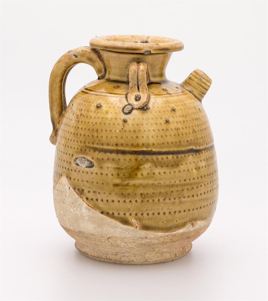 Ewer of green-glazed stoneware and rouletted decoration