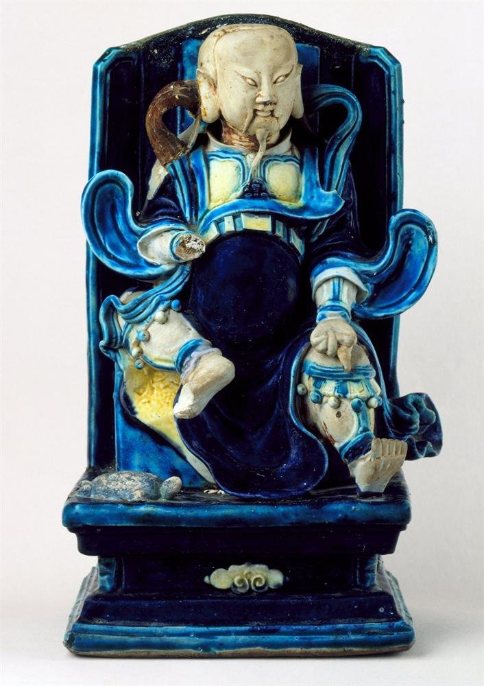 Figure of the God of the North, stoneware with fahua enamels