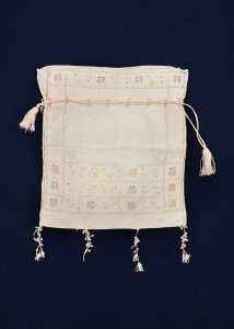 Linen drawstring bag with open work, belonged to Esther Modiano.