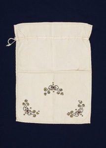 Cotton drawstring bag with coloured embroidery, belonged to Esther Modiano.