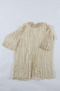 Woman's chemise, cream silk with woven vertical stripes, collar and cuffs edged with crochet trims, probably belonged to a member of the the local Jewish community.