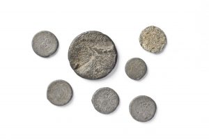 Hoard of coins, weights for clothing and coins used as such.