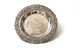 Stamped and repousse silver plate with dedication.