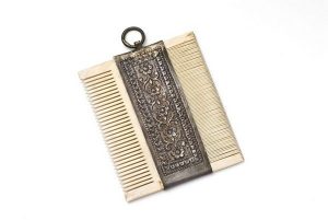 Ivory and silver comb.